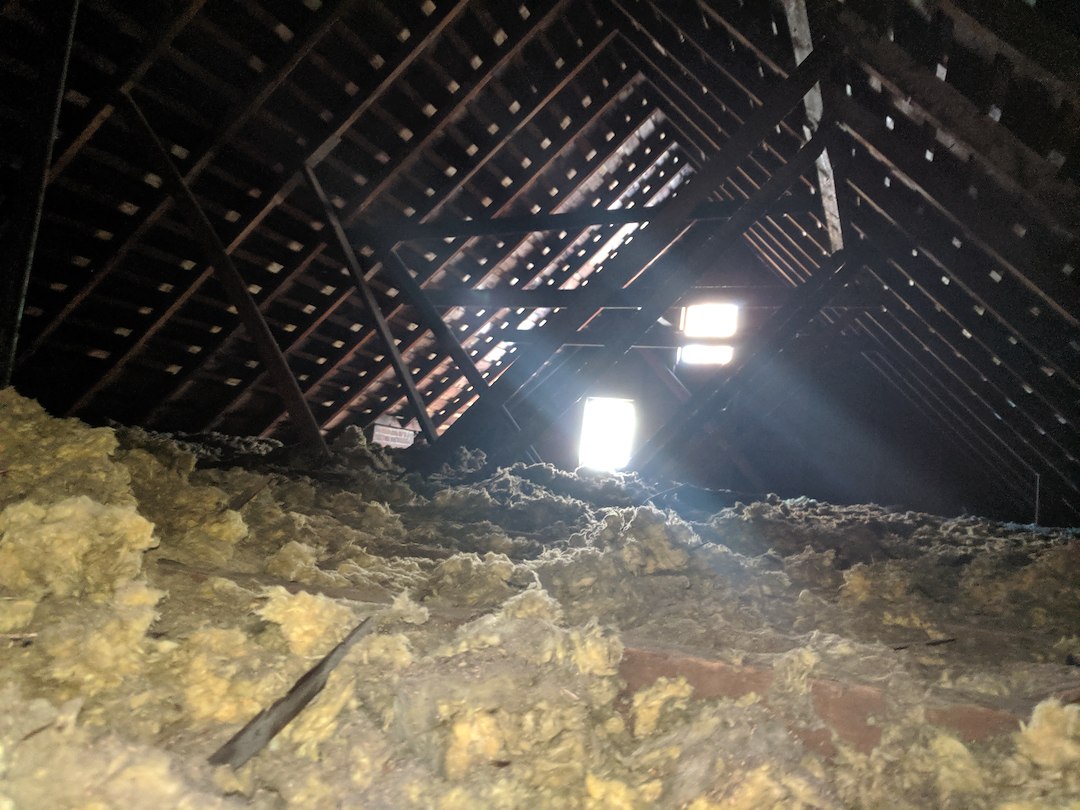 Attic finish with bathroom and fireplace insert in Denver, Colorado. 